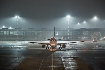 Image showing Airliner at an airport at night