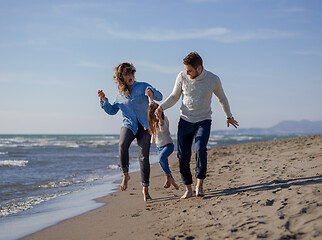 Image showing Young family enjoying vecation during autumn day