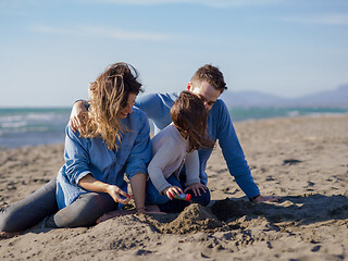 Image showing Young family enjoying vecation during autumn day