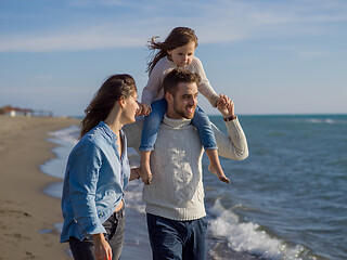 Image showing Young family enjoying vecation during autumn day