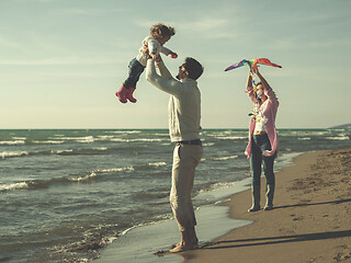 Image showing happy family enjoying vecation during autumn day