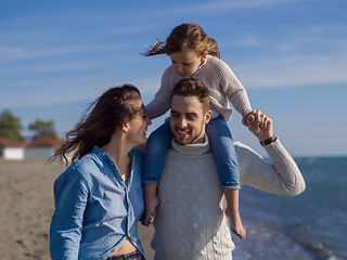 Image showing Young family enjoying vecation during autumn day