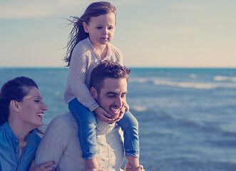 Image showing Young family enjoying vecation during autumn day