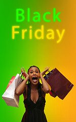 Image showing Beautiful woman inviting for shopping in black friday, sales concept. Vertical flyer, gradient background