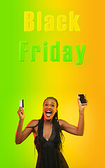 Image showing Beautiful woman inviting for shopping in black friday, sales concept. Vertical flyer, gradient background