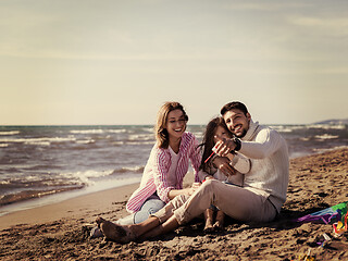 Image showing Young family enjoying vecation during autumn day