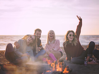 Image showing Friends having fun at beach on autumn day