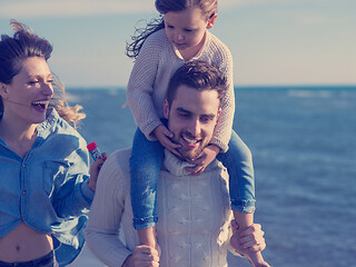 Image showing Young family enjoying vecation during autumn day