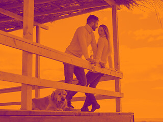 Image showing young couple drinking beer together at the beach