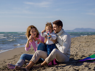 Image showing Young family enjoying vecation during autumn day