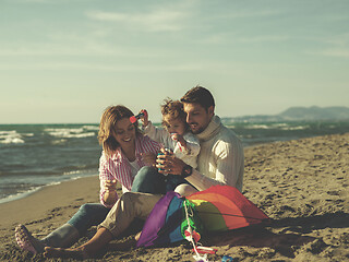 Image showing Young family enjoying vecation during autumn day