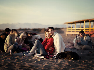 Image showing couple on a beach at autumn sunny day