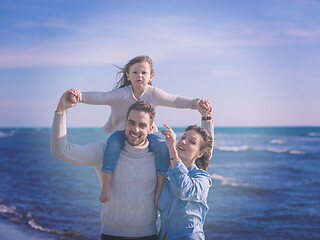 Image showing Young family enjoying vecation during autumn day