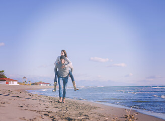 Image showing couple having fun at beach during autumn