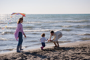 Image showing happy family enjoying vecation during autumn day