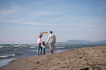 Image showing happy family enjoying vecation during autumn day