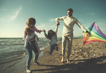 Image showing happy family enjoying vecation during autumn day