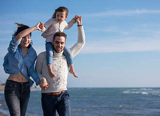 Image showing Young family enjoying vecation during autumn