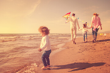 Image showing happy family enjoying vecation during autumn day