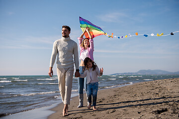 Image showing happy family enjoying vecation during autumn day