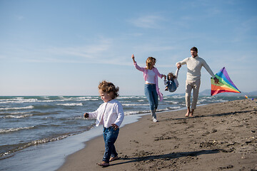 Image showing happy family enjoying vecation during autumn day