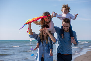 Image showing happy family enjoying vecation during autumn day