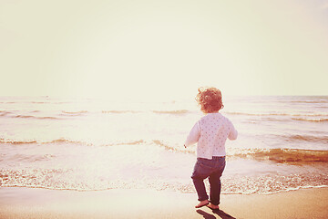 Image showing cute little girl at autumn beach