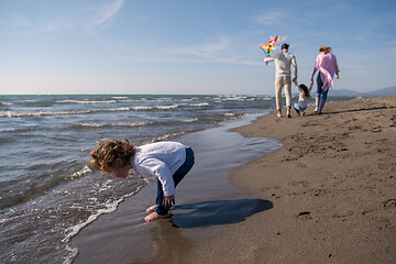 Image showing happy family enjoying vecation during autumn day