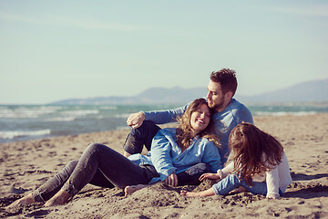 Image showing Young family enjoying vecation during autumn