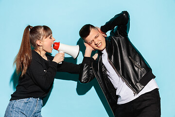 Image showing Portrait of young emotional female student with megaphone