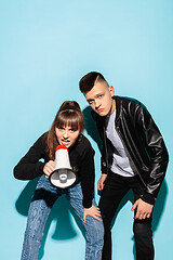 Image showing Portrait of young emotional female student with megaphone