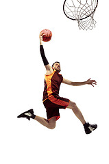 Image showing Full length portrait of a basketball player with ball