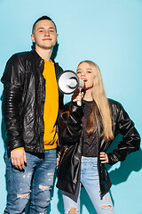 Image showing Portrait of young emotional female student with megaphone