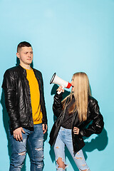 Image showing Portrait of young emotional female student with megaphone