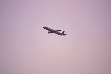Image showing plane sunset haze