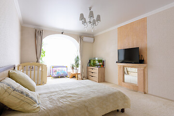 Image showing Interior of a spacious bedroom with furniture and a nice light design