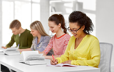 Image showing high school students with books and notebooks