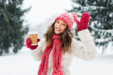 Image showing happy teenage girl with coffee in winter park