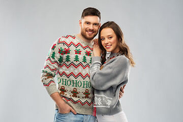 Image showing happy couple at christmas ugly sweater party