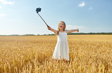 Image showing happy young girl taking selfie by smartphone