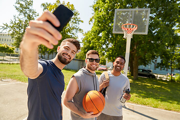 Image showing happy men taking selfie on basketball playground