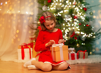 Image showing girl with christmas gift at home