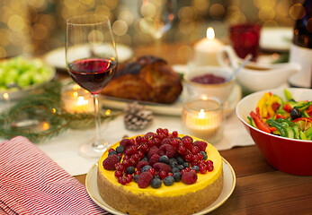 Image showing cake and other food on christmas table at home