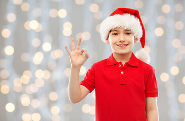 Image showing smiling boy in santa helper hat showing ok gesture