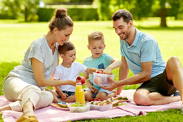 Image showing happy family having picnic at summer park