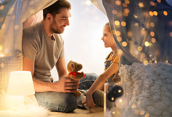 Image showing happy family playing with toy in kids tent at home