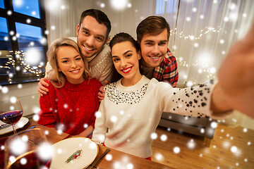 Image showing friends taking selfie at christmas dinner