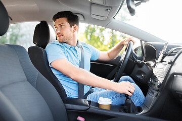 Image showing man or driver driving car and looking back