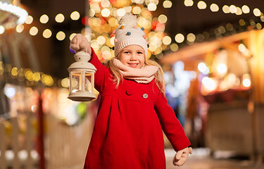 Image showing happy little girl at christmas with lantern market