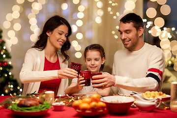 Image showing happy family having christmas dinner at home